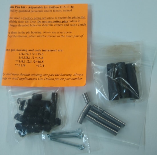 A package of screws, nuts and bolts on a table, including the Ski-Doo TRA pins 11.5~22.8 grams.