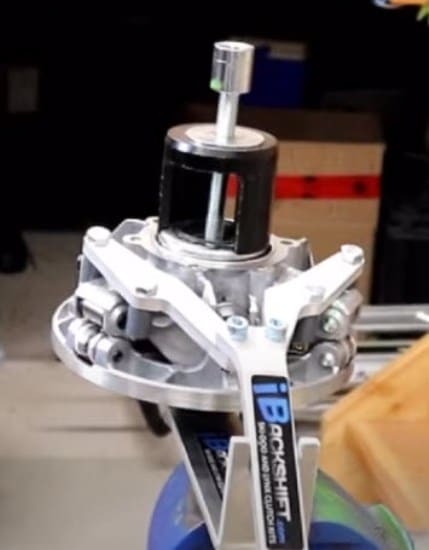 A Ski-Doo pDrive Tool Clutch Circlip Installer/Remover robot with a motor attached to it.